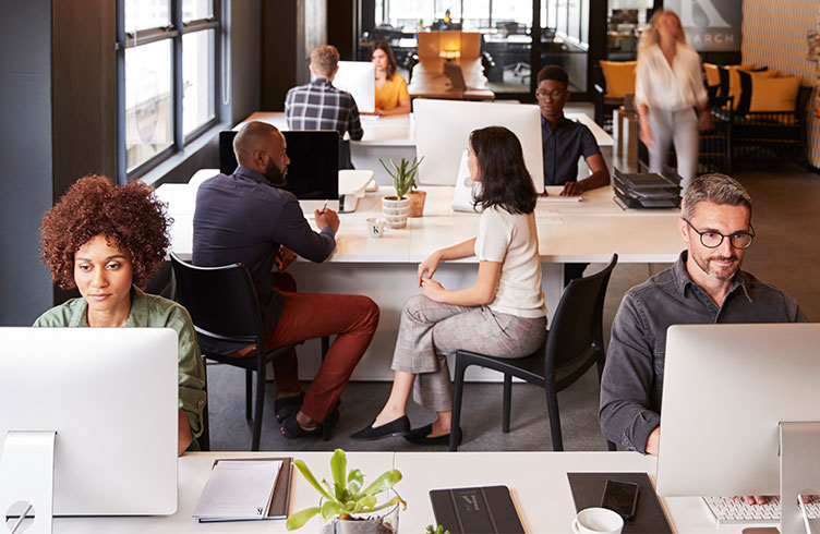 Ksquared Search employees working in the office
